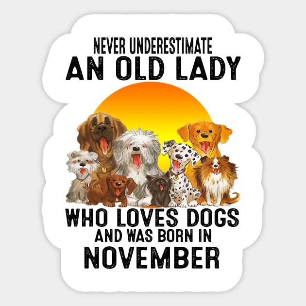 Never Underestimate An Old November Lady Who Loves Dogs Sticker by trainerunderline